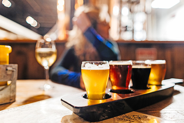A row of beer glasses on a table