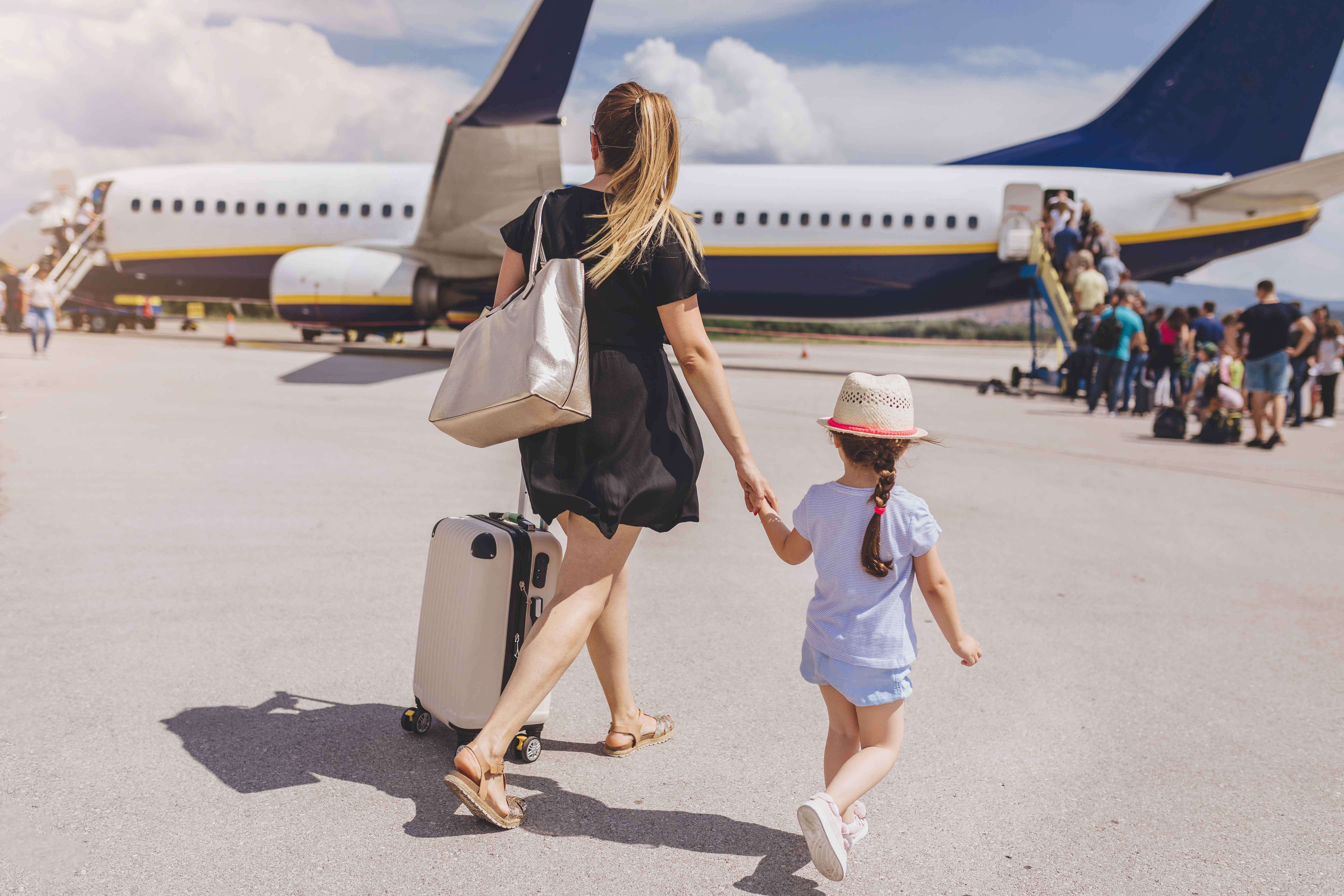 Travelers walking to airplane