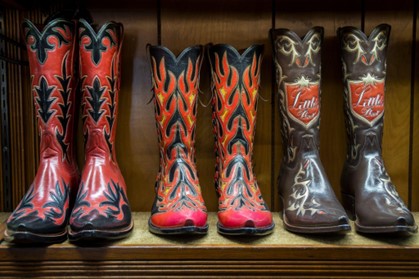Pairs of cowboys boots in a line