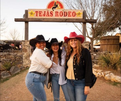People in front of the Tejas Rodeo