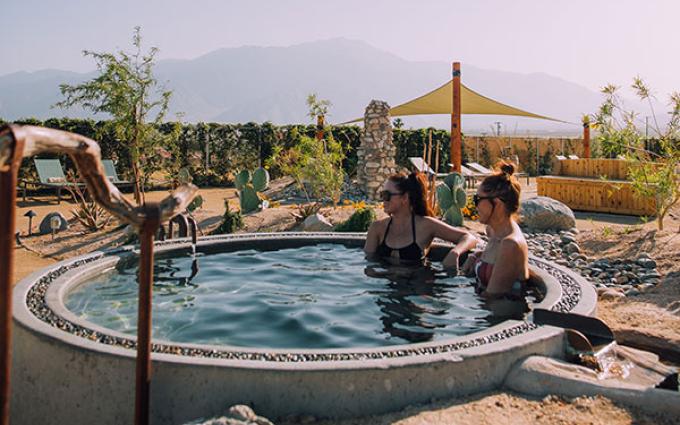 two people in tub in desert