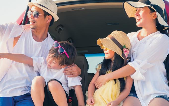 Family in the back of a hatchback care
