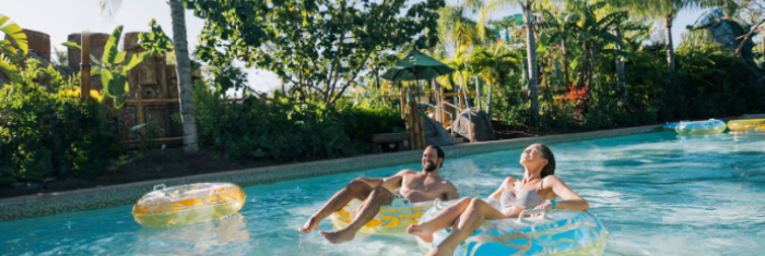 Two people enjoying the water in inner tubes